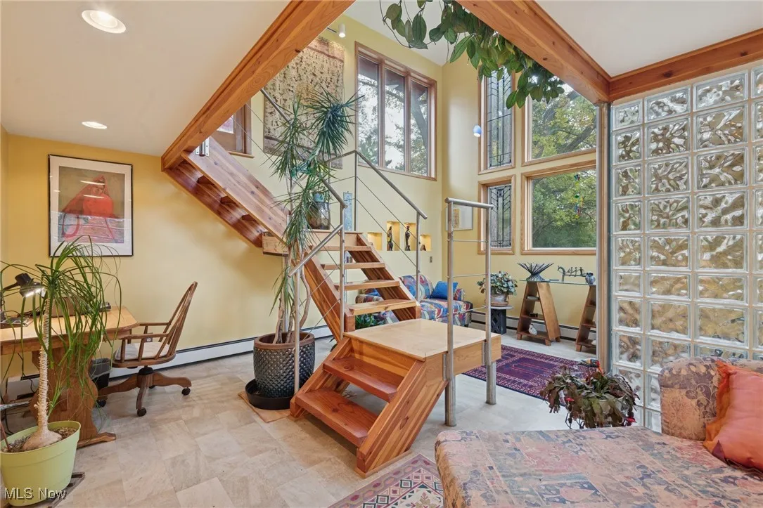 The Sunroom on the lower level features lounge and workplace areas