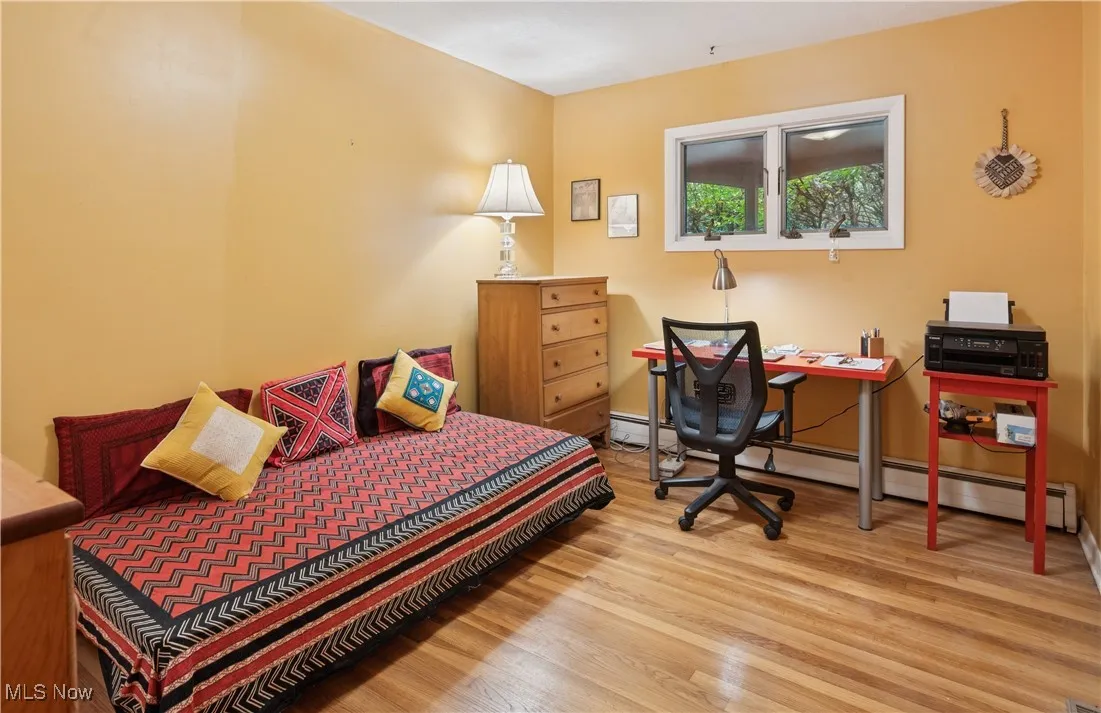 One of three bedrooms on the main level. Features high windows to allow flexible furniture placement.