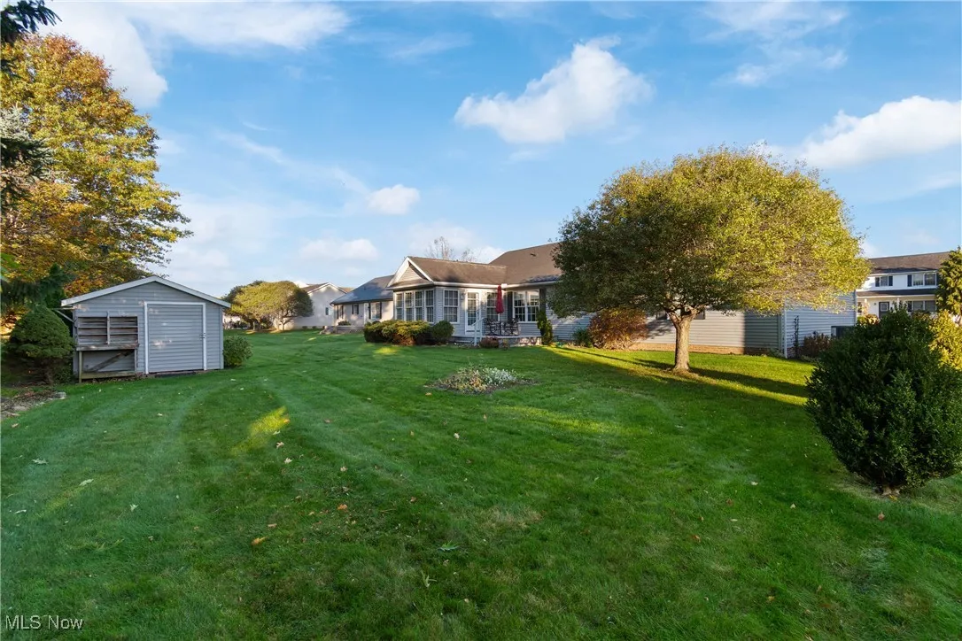 Oversized shed for lawn and gardening tools.