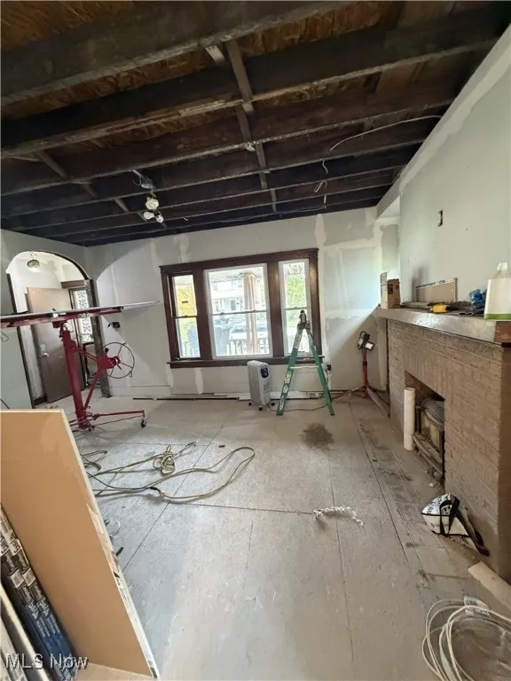 Below grade area with a fireplace and arched walkways