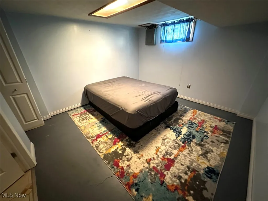 Bedroom in lower level with baseboards
