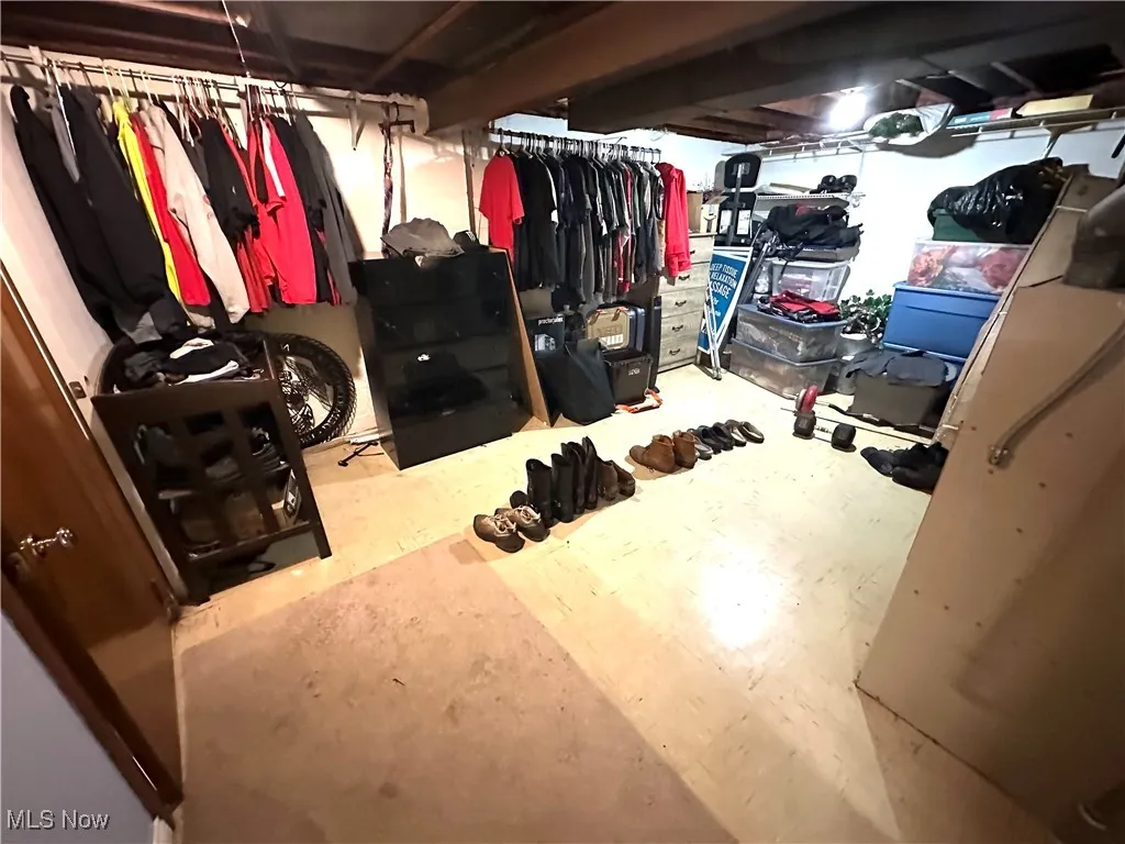View of spacious closet and utility room in basement