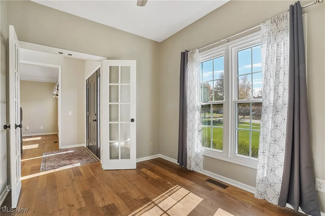 Doorway to outside featuring hardwood / wood-style floors and french doors