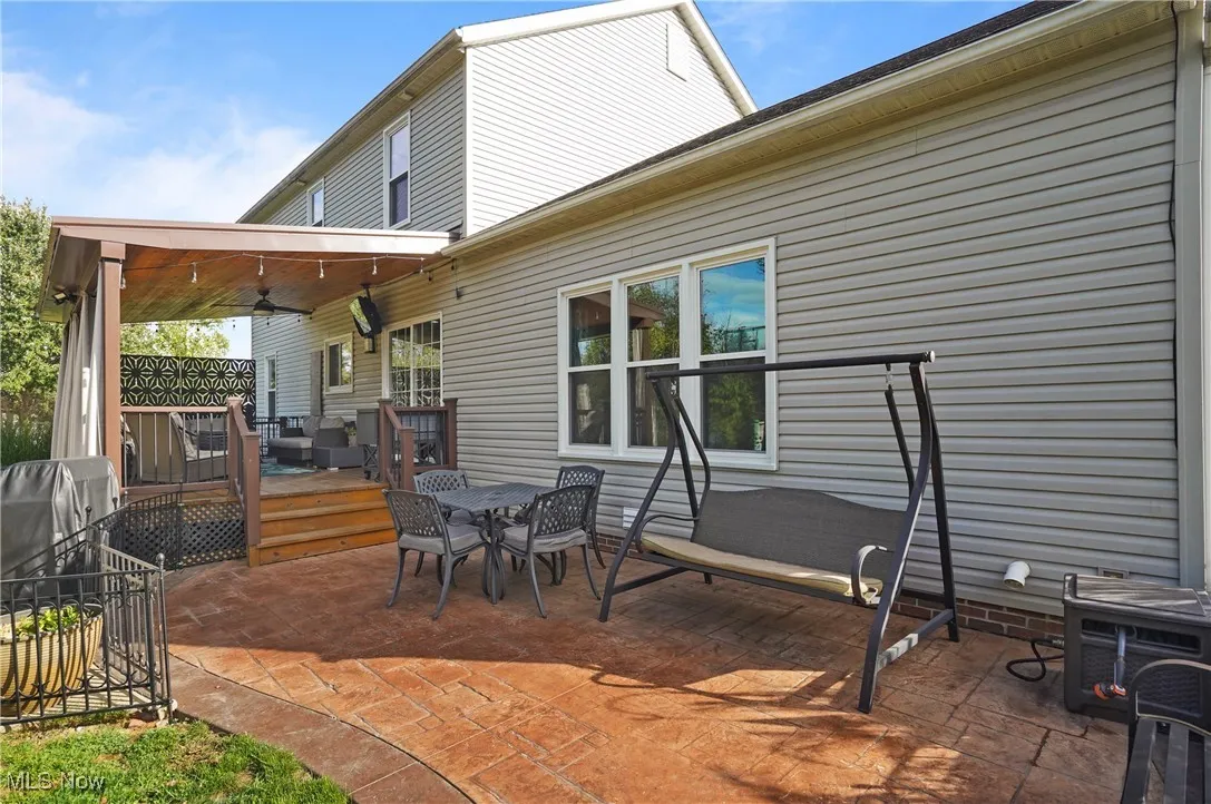 View of patio / terrace featuring grilling area, outdoor dining space, and a deck