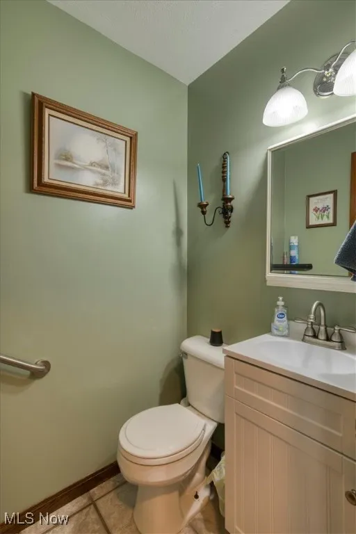 Bathroom with vanity and light tile patterned flooring