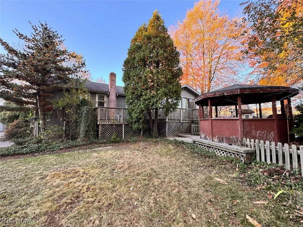 View of yard featuring a deck and a gazebo