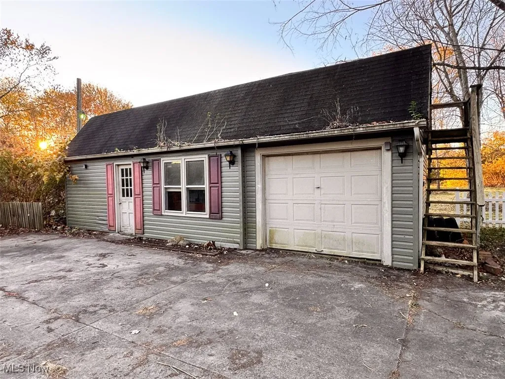 View of detached and driveway