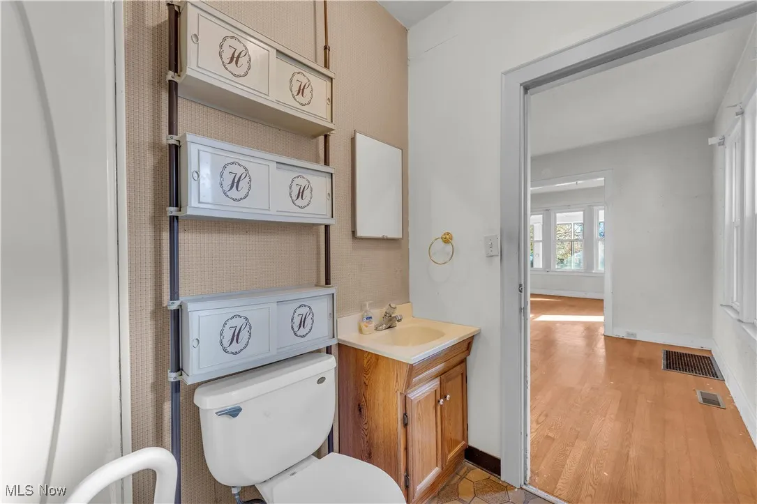 Bathroom with vanity and light wood-style floors