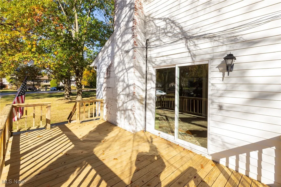 Wooden deck featuring a yard