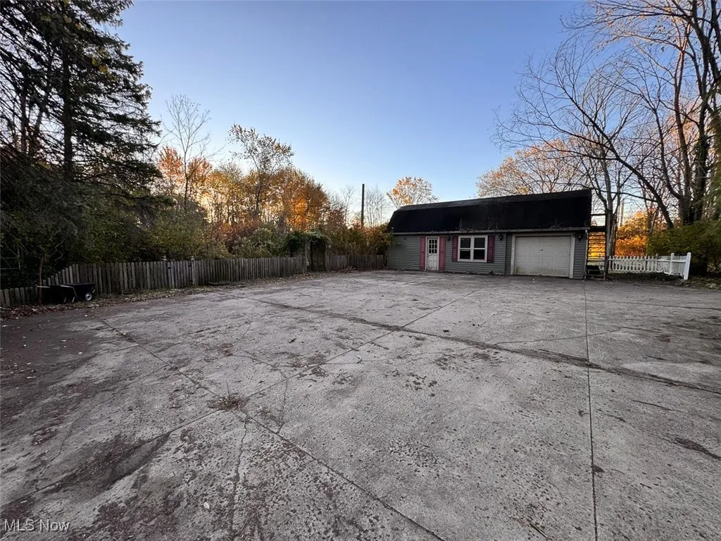Garage with concrete driveway