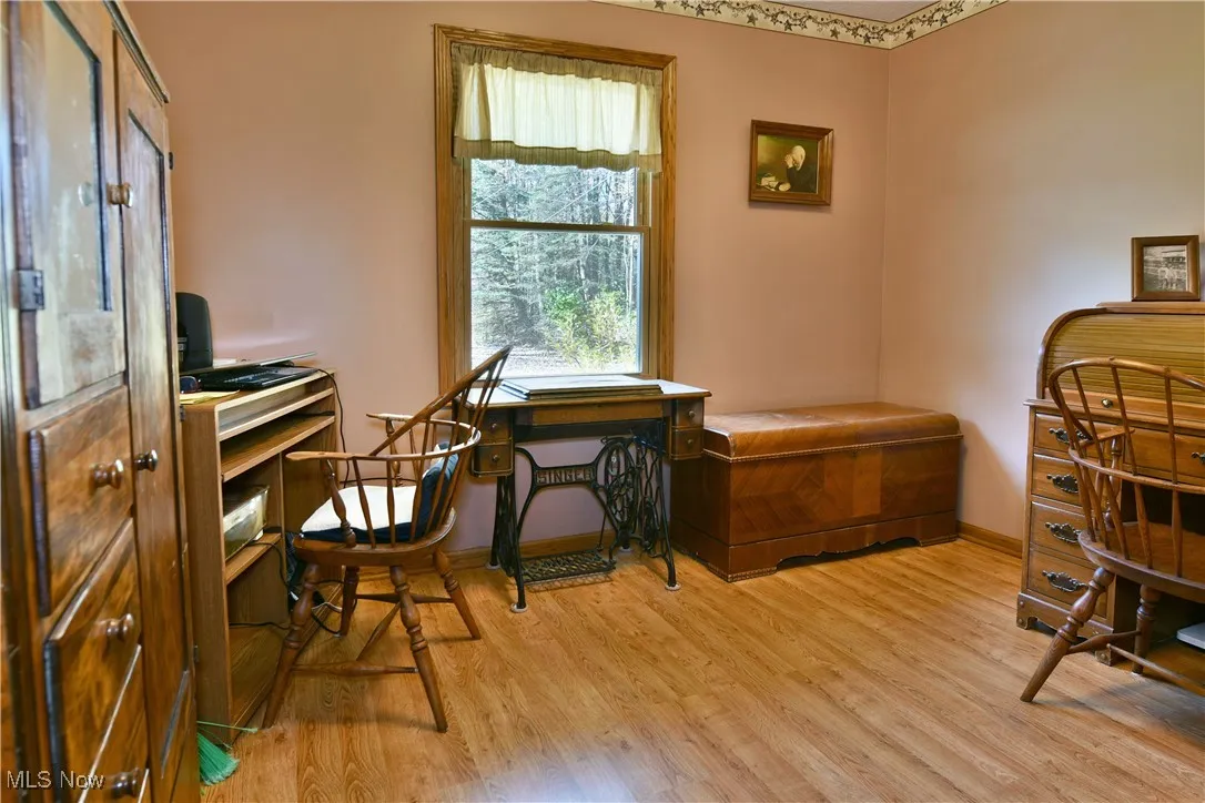 Office featuring light wood-style flooring and baseboards