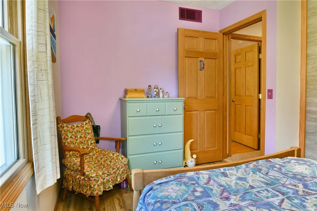Bedroom with wood finished floors