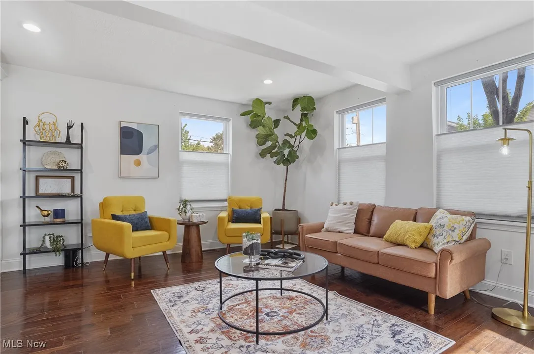 Living room featuring recessed lighting and dark wood finished floors