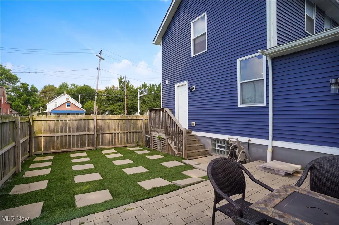 Fenced backyard featuring a patio