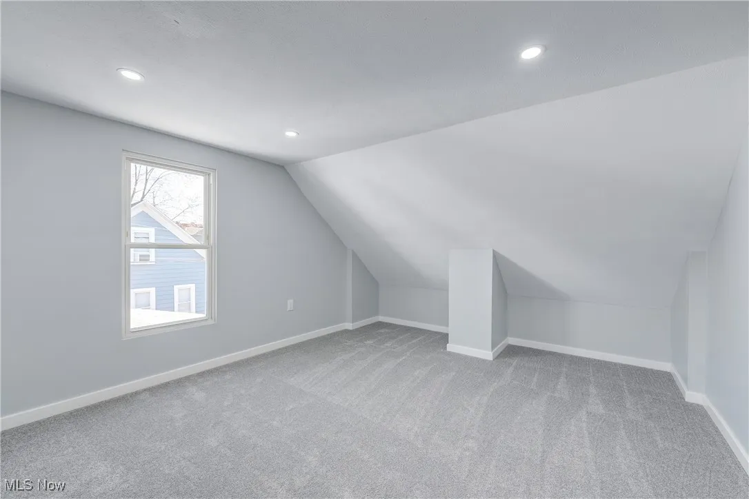 Additional living space featuring recessed lighting, baseboards, carpet, and vaulted ceiling