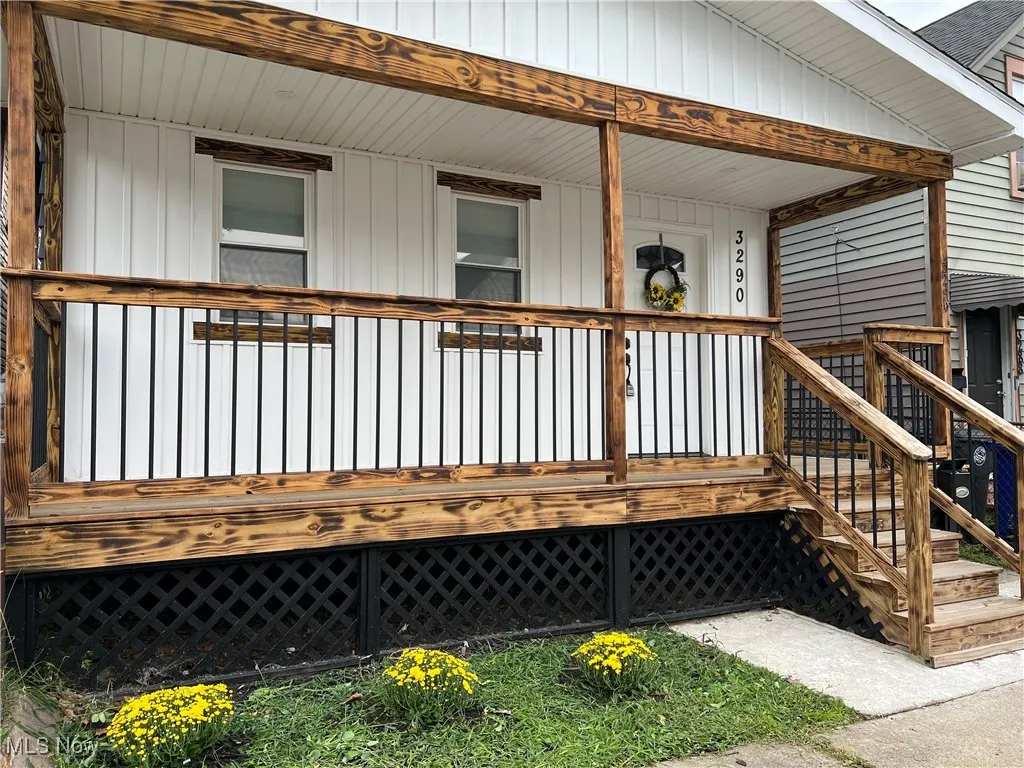 Wooden porch featuring stairs
