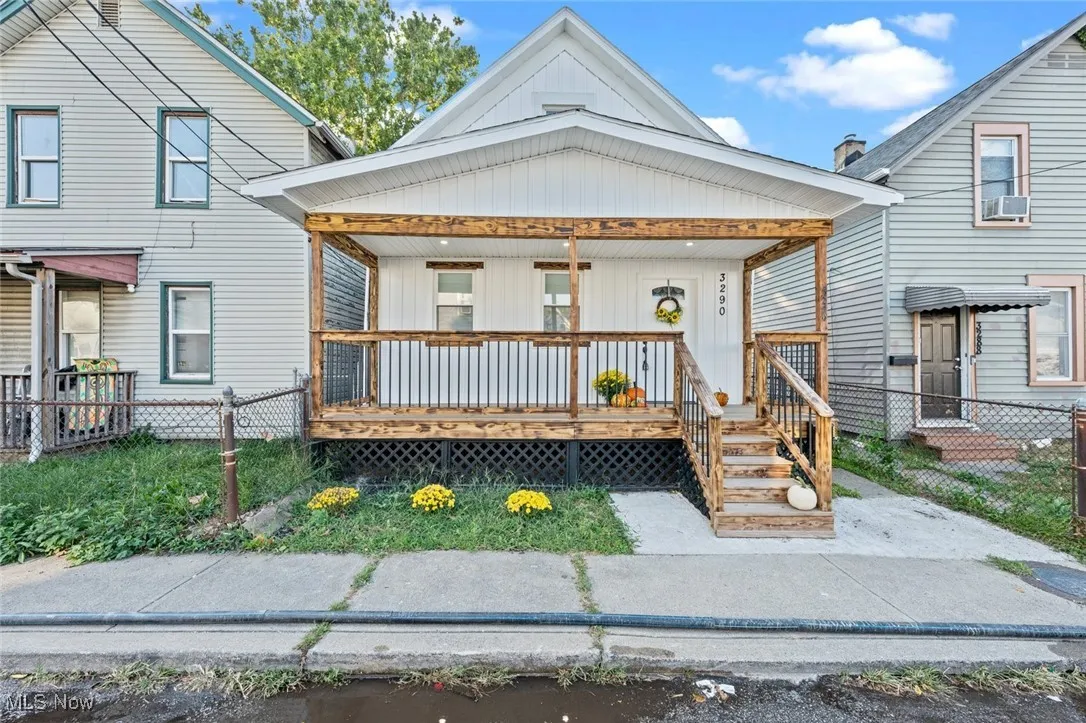 View of front of house with covered porch and board and batten siding