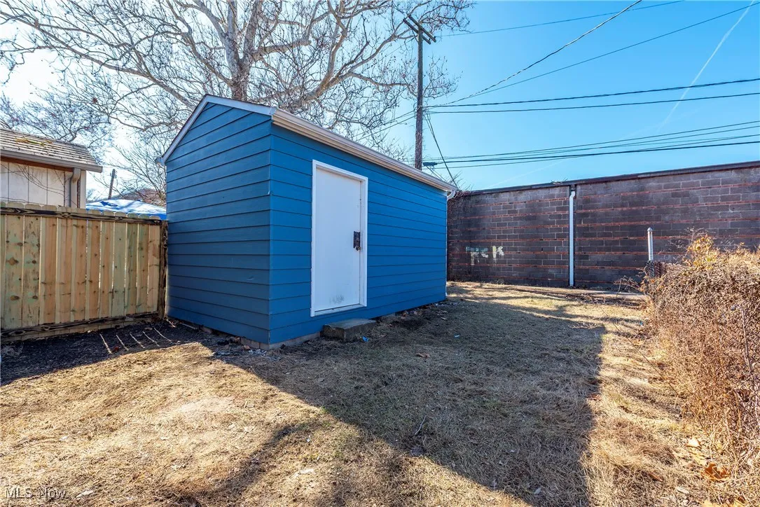 View of shed with a fenced backyard