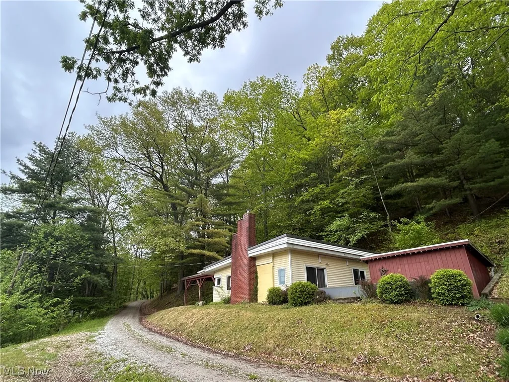View of home's exterior featuring a chimney