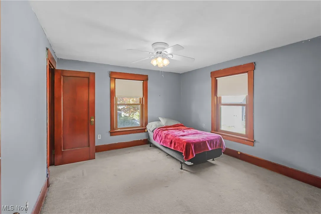 Bedroom with carpet floors and ceiling fan