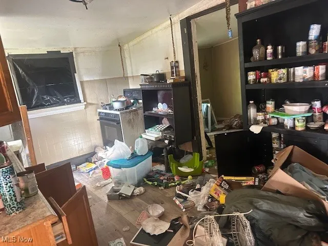 Miscellaneous room featuring wood finished floors