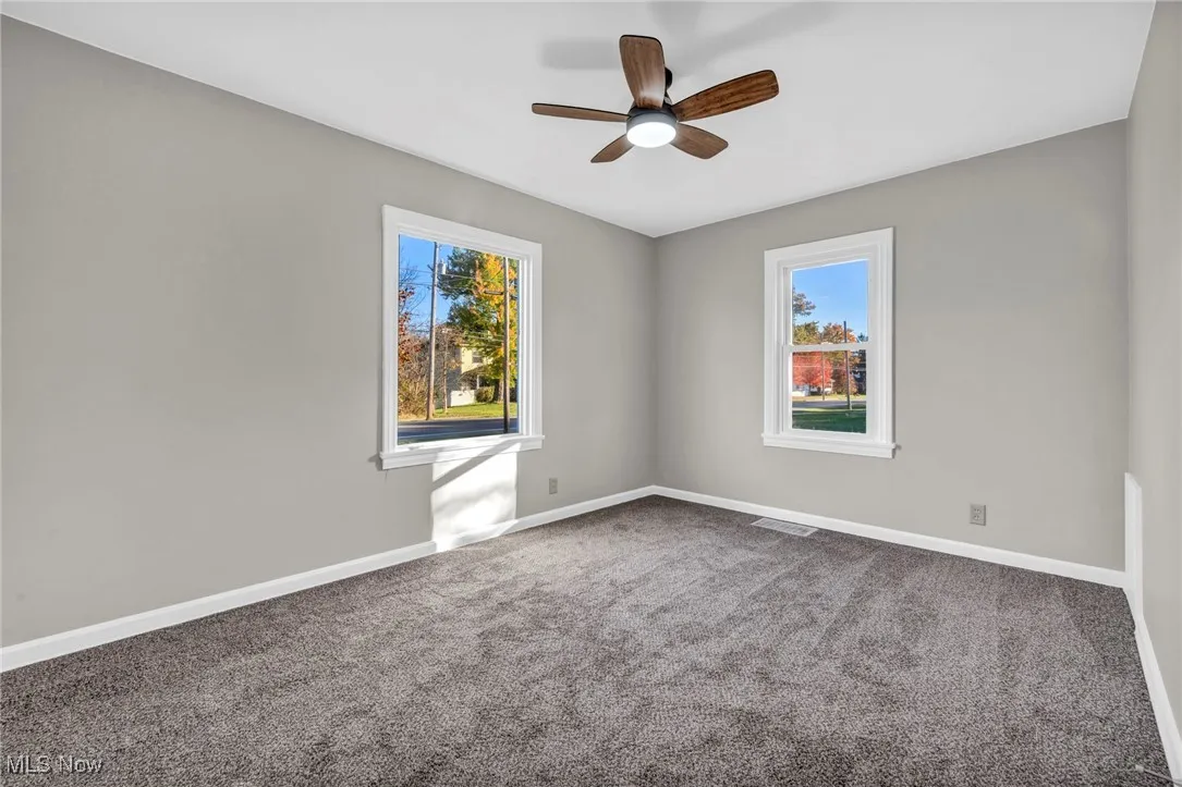 Bedroom 2 room with carpet floors and ceiling fan