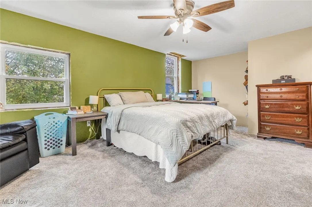 Bedroom featuring carpet flooring and a ceiling fan
