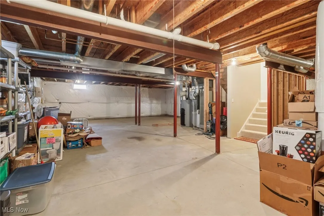 Unfinished basement featuring stairs