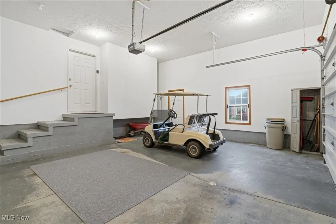 Garage featuring a garage door opener