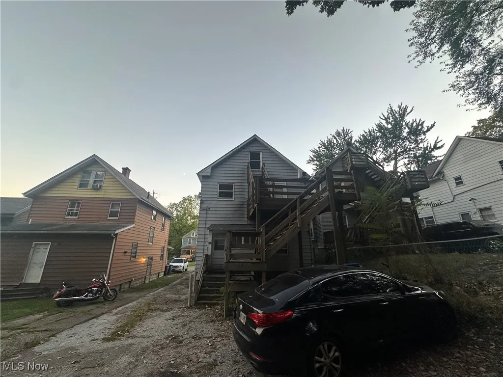 Rear view of house with stairs
