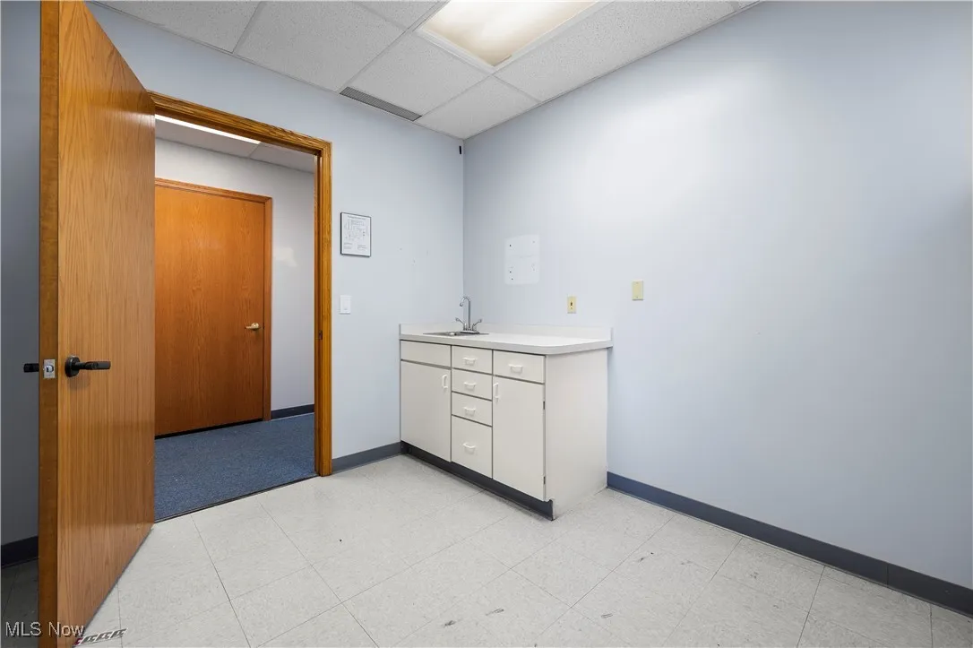 Bathroom featuring vanity and a paneled ceiling