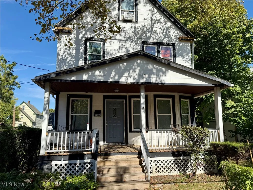 Traditional style home featuring covered porch