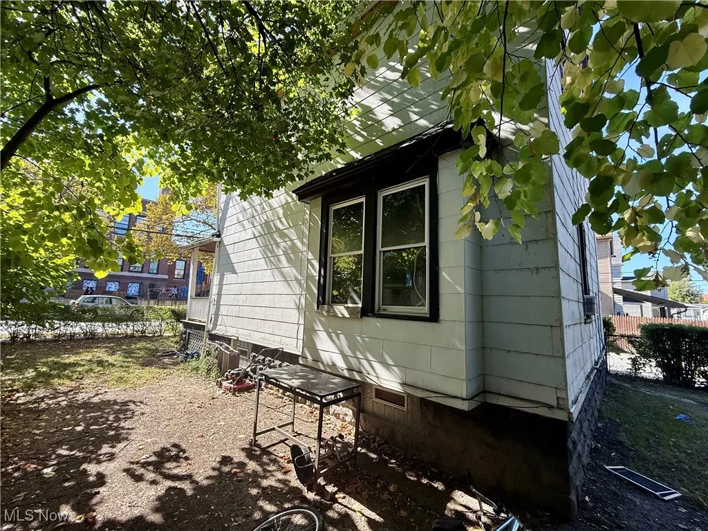 View of side of property featuring a patio