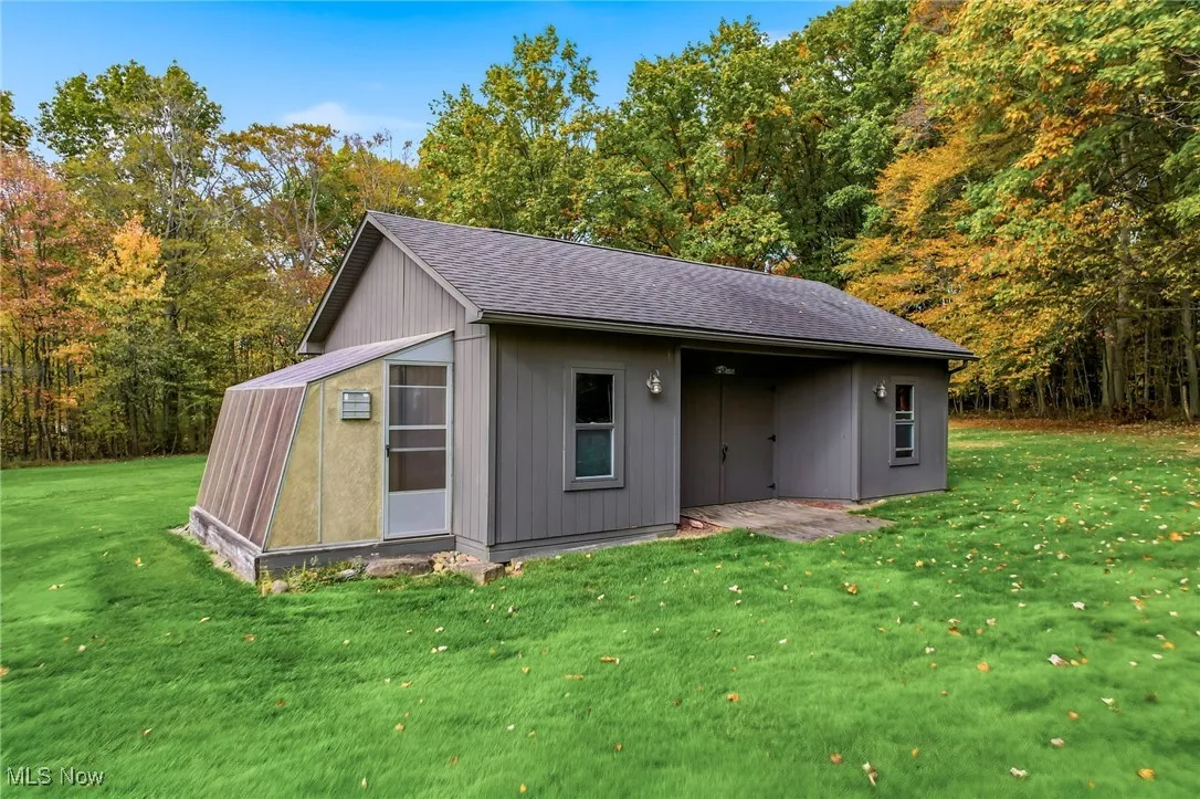 View of outdoor structure with a forest view
