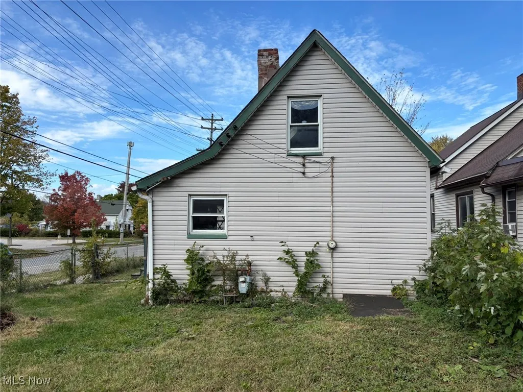 View of home's exterior featuring a chimney