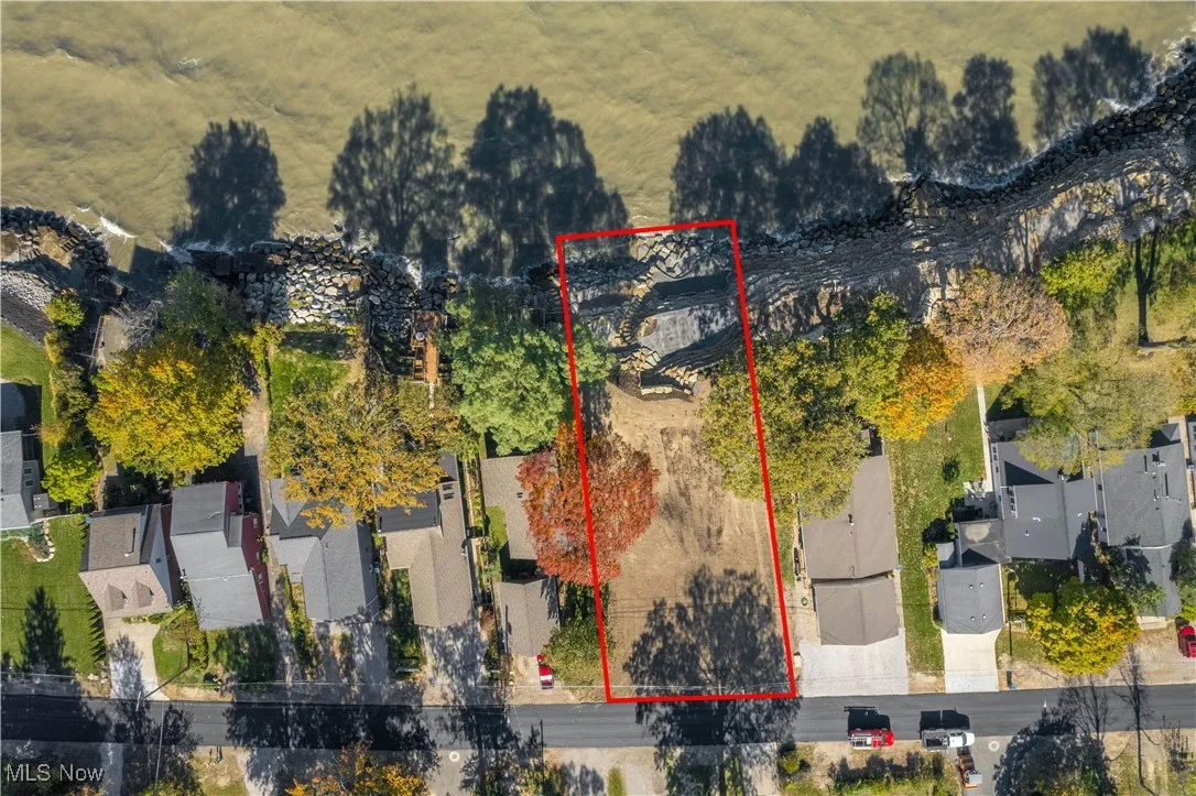 Aerial view of residential area featuring property boundaries highlighted