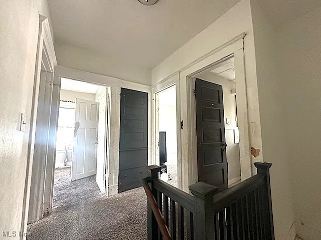 Hall featuring carpet