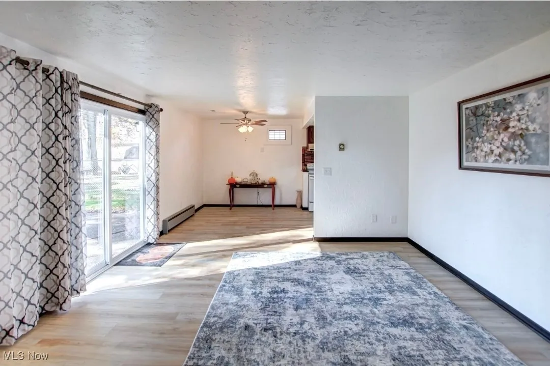 Unfurnished Room with light wood-style flooring