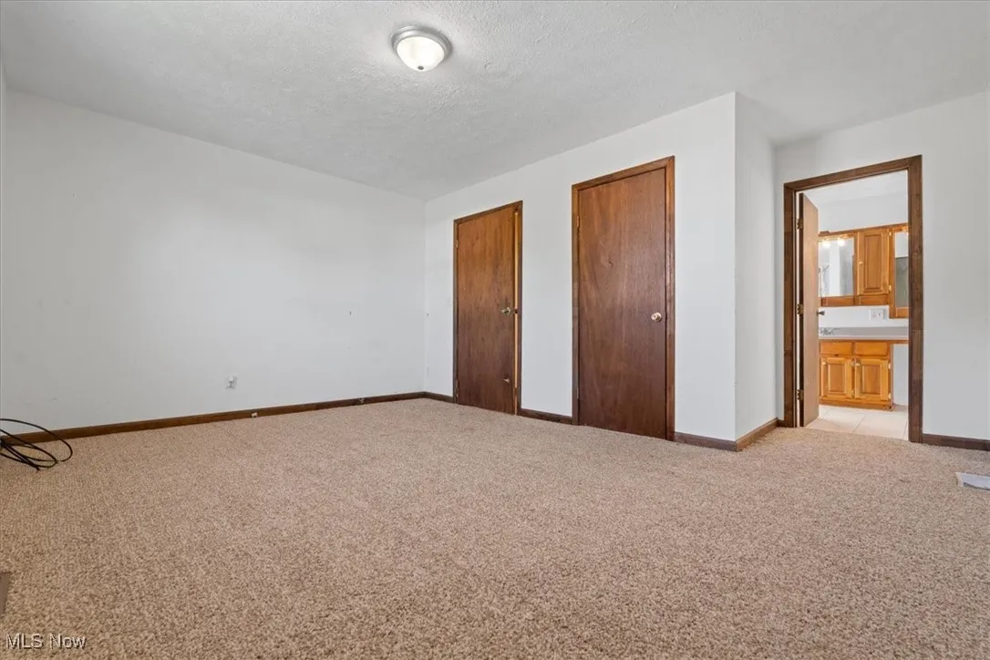 Primary bedroom with private full bathroom