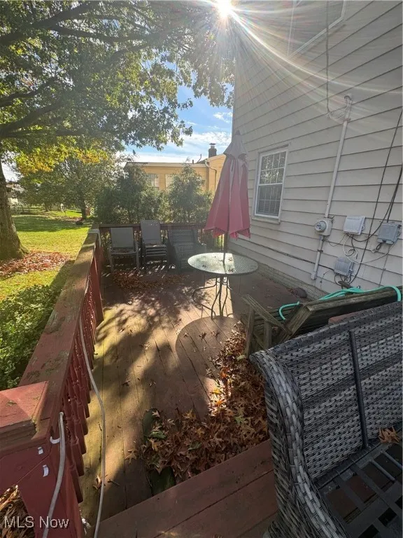 View of patio / terrace with a wooden deck and outdoor dining area