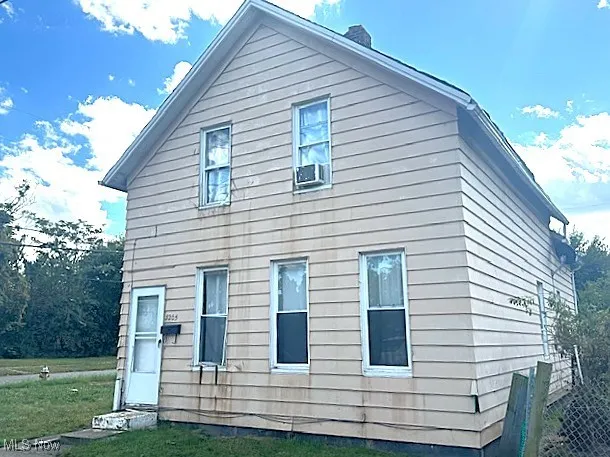 View of home's exterior featuring a chimney