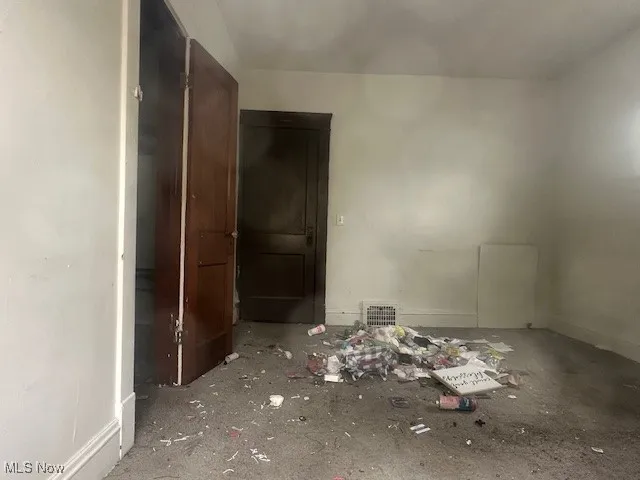 Unfurnished bedroom featuring baseboards