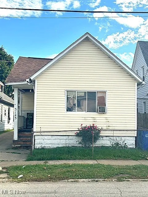 View of side of property with a fenced front yard