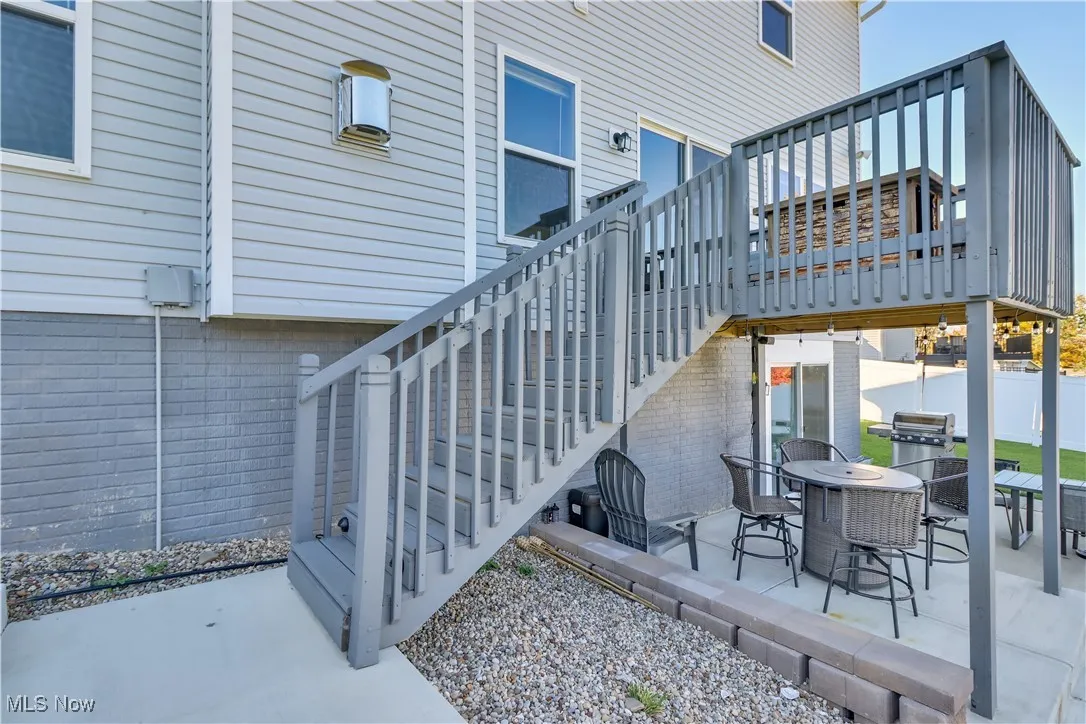 View of patio / terrace featuring stairs and outdoor dining area