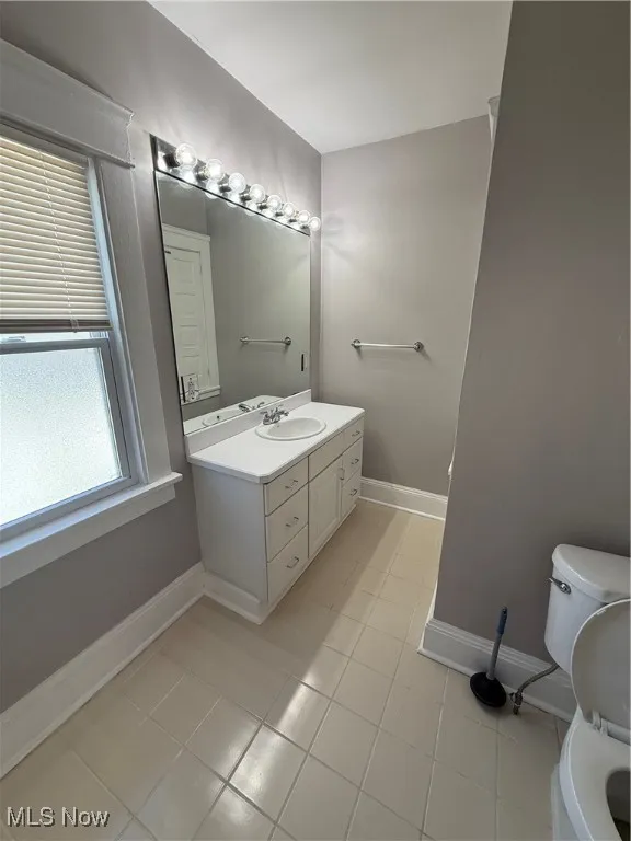 Bathroom featuring vanity and light tile patterned flooring