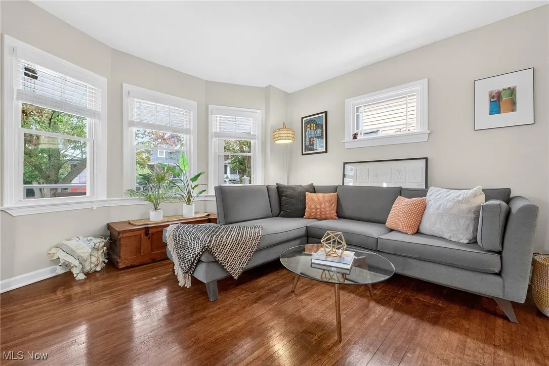 Living area with wood-type flooring and baseboards