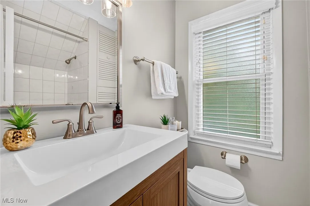 Bathroom with vanity and a shower