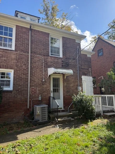 View of front of property featuring brick siding