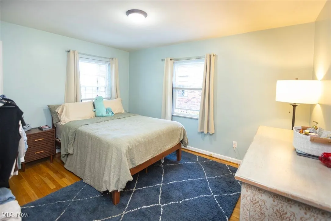 Down unit Bedroom 1 featuring wood finished floors