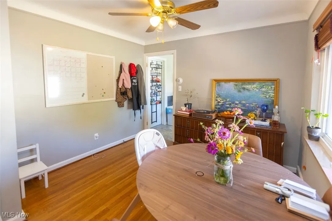 Up unit Dining space featuring wood finished floors and a ceiling fan
